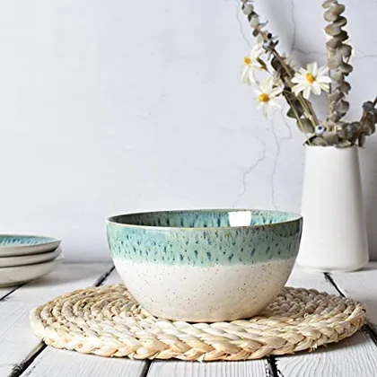 A Bosmarlin mug in a reactive glaze