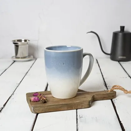 A Bosmarlin mug in a reactive glaze