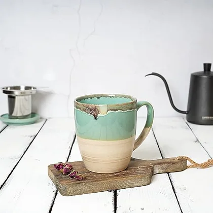 A Bosmarlin mug in a reactive glaze