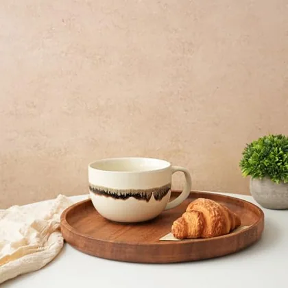A Bosmarlin mug in a reactive glaze