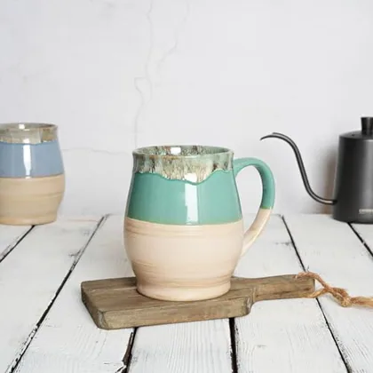 A Bosmarlin mug in a reactive glaze