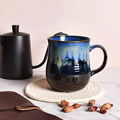 A Bosmarlin mug in a reactive glaze