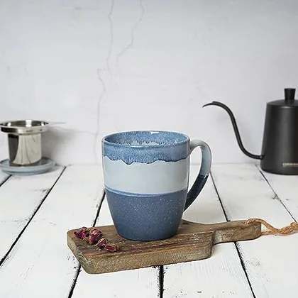 A Bosmarlin mug in a reactive glaze