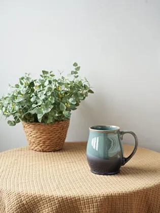 A Bosmarlin mug in a reactive glaze