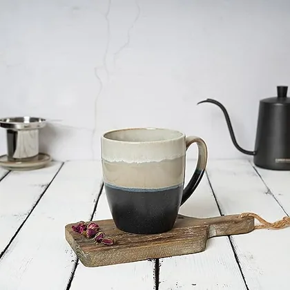 A Bosmarlin mug in a reactive glaze