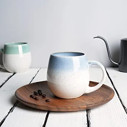 A Bosmarlin mug in a reactive glaze