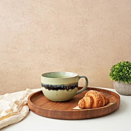 A Bosmarlin mug in a reactive glaze