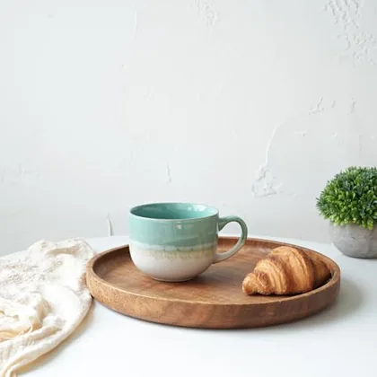 A Bosmarlin mug in a reactive glaze