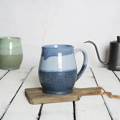 A Bosmarlin mug in a reactive glaze