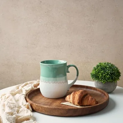 A Bosmarlin mug in a reactive glaze