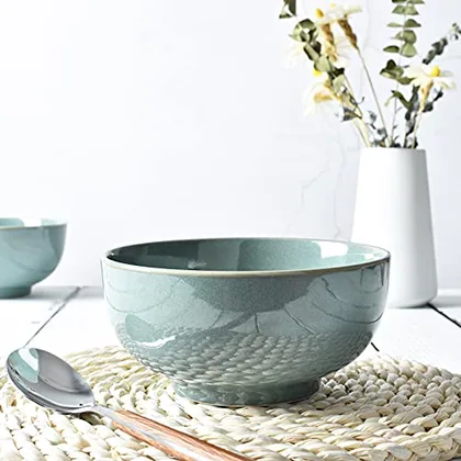 A Bosmarlin mug in a reactive glaze