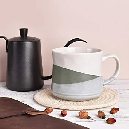 A Bosmarlin mug in a reactive glaze