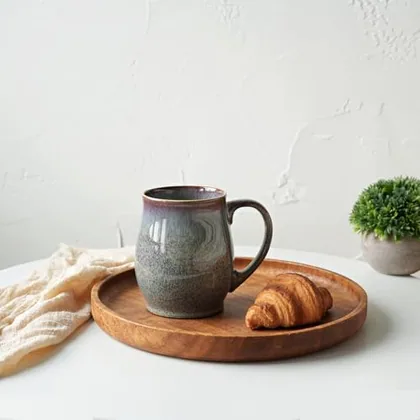 A Bosmarlin mug in a reactive glaze