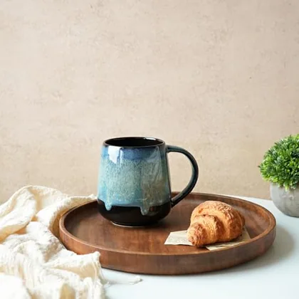 A Bosmarlin mug in a reactive glaze