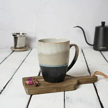 A Bosmarlin mug in a reactive glaze