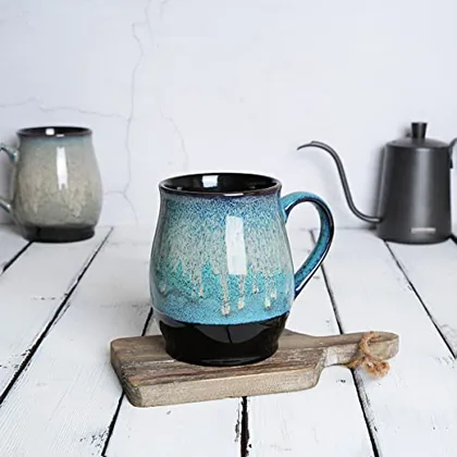 A Bosmarlin mug in a reactive glaze