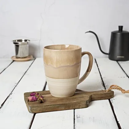 A Bosmarlin mug in a reactive glaze