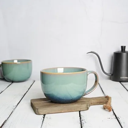 A Bosmarlin mug in a reactive glaze