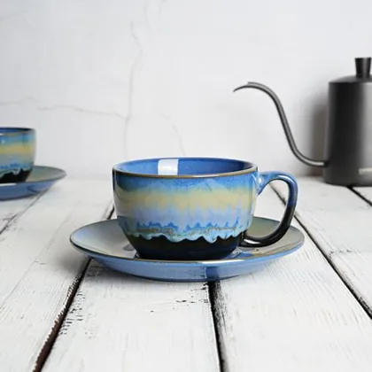 A Bosmarlin mug in a reactive glaze