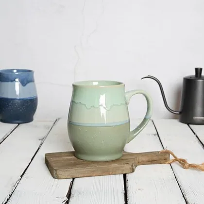 A Bosmarlin mug in a reactive glaze
