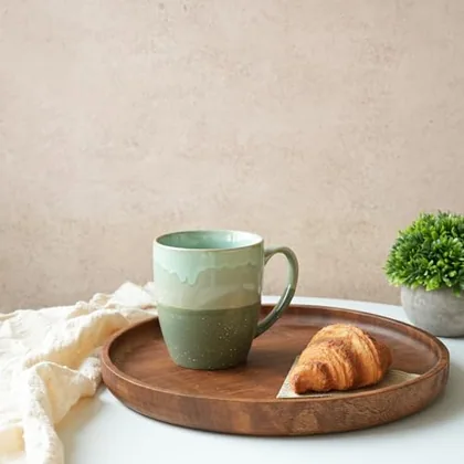 A Bosmarlin mug in a reactive glaze