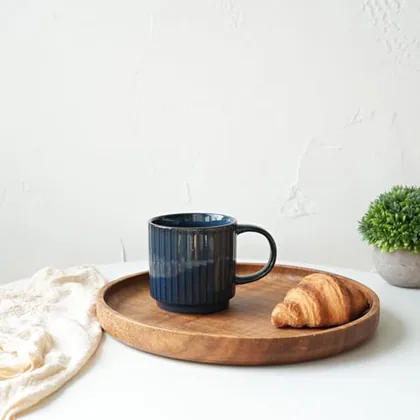A Bosmarlin mug in a reactive glaze