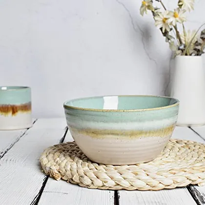 A Bosmarlin mug in a reactive glaze