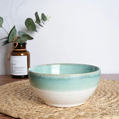 A Bosmarlin mug in a reactive glaze