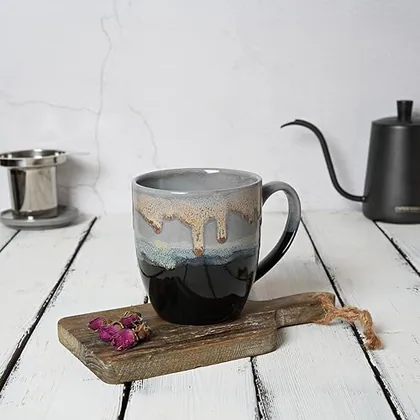 A Bosmarlin mug in a reactive glaze