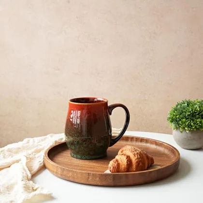 A Bosmarlin mug in a reactive glaze