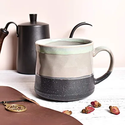 A Bosmarlin mug in a reactive glaze