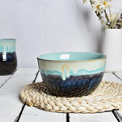 A Bosmarlin mug in a reactive glaze