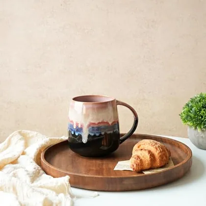 A Bosmarlin mug in a reactive glaze
