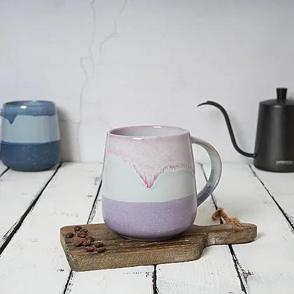 A Bosmarlin mug in a reactive glaze