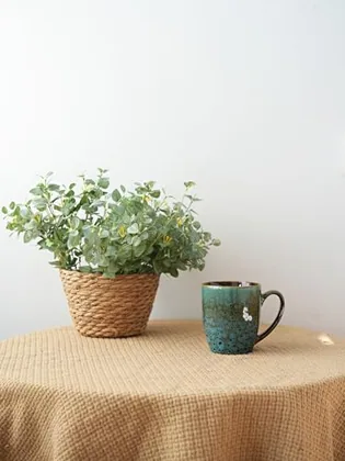 A Bosmarlin mug in a reactive glaze