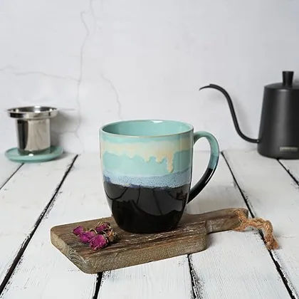 A Bosmarlin mug in a reactive glaze
