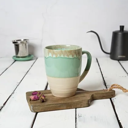A Bosmarlin mug in a reactive glaze