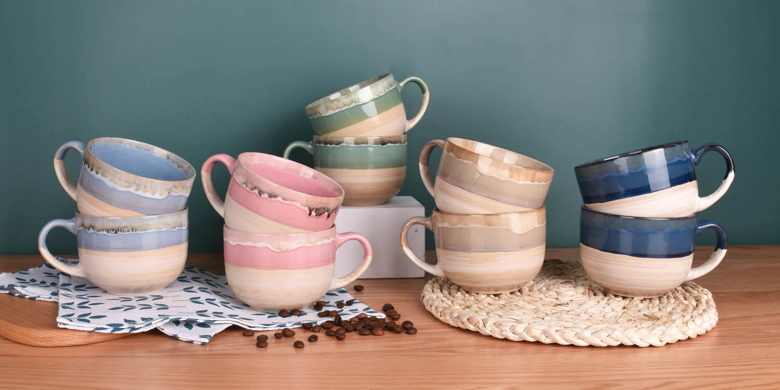 Bosmarlin mugs in reactive glazes on a wooden table
