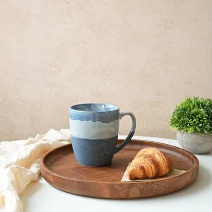 A Bosmarlin mug in a reactive glaze