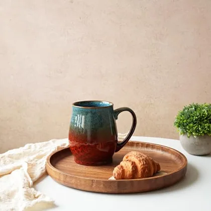 A Bosmarlin mug in a reactive glaze