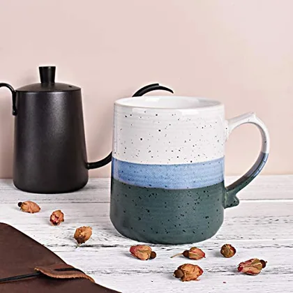 A Bosmarlin mug in a reactive glaze