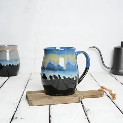 A Bosmarlin mug in a reactive glaze