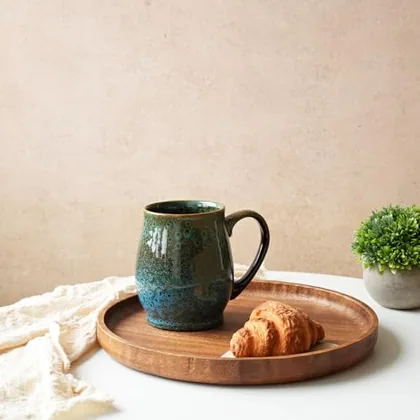A Bosmarlin mug in a reactive glaze