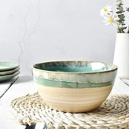 A Bosmarlin mug in a reactive glaze