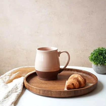 A Bosmarlin mug in a reactive glaze