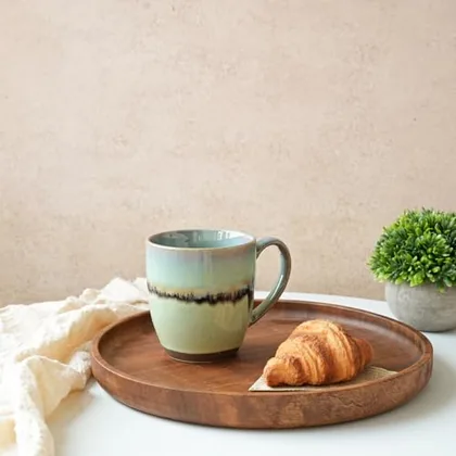 A Bosmarlin mug in a reactive glaze