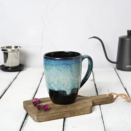 A Bosmarlin mug in a reactive glaze
