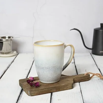 A Bosmarlin mug in a reactive glaze