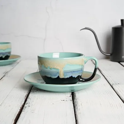 A Bosmarlin mug in a reactive glaze
