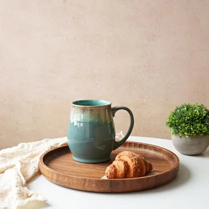 A Bosmarlin mug in a reactive glaze
